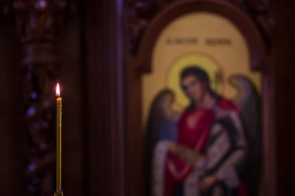 Burning candles during church service. Blur icon background Royalty Free Stock Images