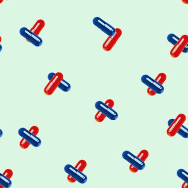 Red-blue tablets - capsules on a colored background. Pattern.