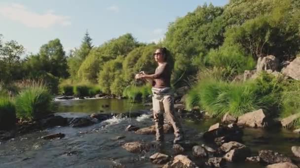 Young Asian Female Standing Fly Fishing Riffle River — Stock Video