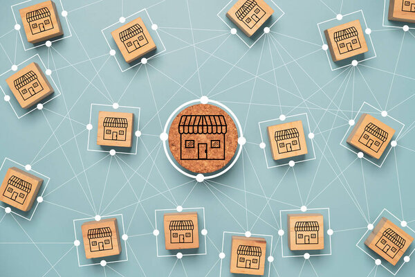 Business sale growth and expand shop franchise concept, Store illustration print screen on wooden cube block connection link with others shop and supermarket.