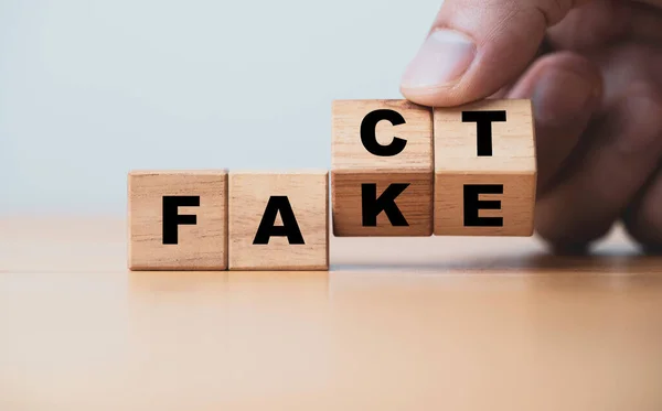Hand Flipping Change Fact Fake Wording Wooden Cube Block News — Stock Photo, Image