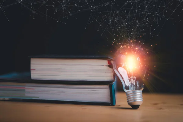 Glowing lightbulb standing with books and connection line for education study can make imagination and creative thinking idea of problem solving concept.