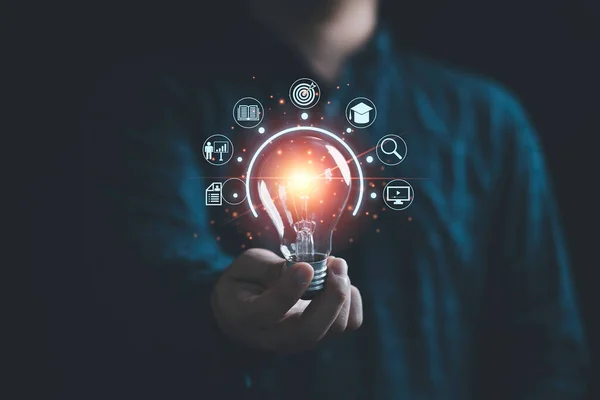 Businessman Holding Glowing Lightbulb Learning Icons Study Knowledge Creative Thinking — Zdjęcie stockowe