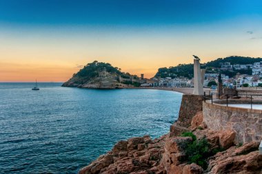 Castell de San Juan and beach at Lloret de Mar at sunset in Spain