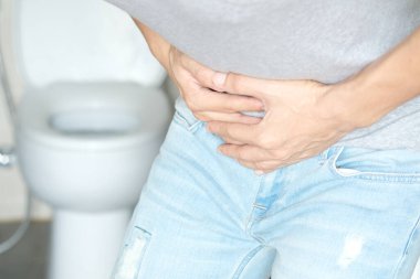 People have abdominal pain. Take a hand from the belly diarrhea.Health and medical concepts