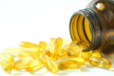 İyi yağlı balık yağı ve E vitamini takviyeleri, sağlık ve vücut.