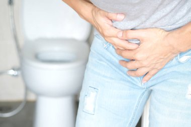 People have abdominal pain. Take a hand from the belly diarrhea.Health and medical concepts