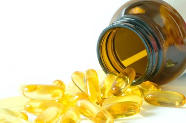 İyi yağlı balık yağı ve E vitamini takviyeleri, sağlık ve vücut.