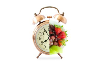 Vintage watch and healthy fruit platter, organic food and fruit and vegetable vitamins. The concept of nutrition, healthy food.