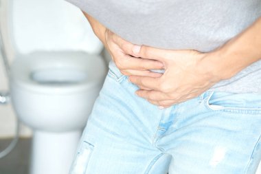 People have abdominal pain. Take a hand from the belly diarrhea.Health and medical concepts