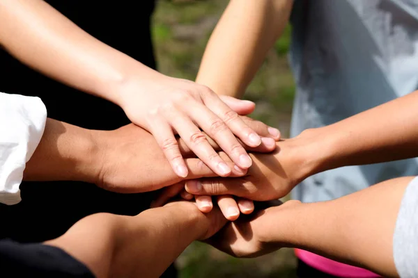 seven hand up of people working assemble corporate meeting show symbol Join forces teamwork quality and effective personnel Concept organizational development in teamwork and business