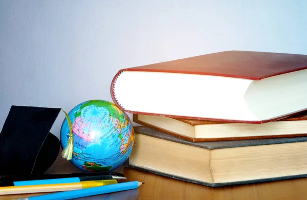 Old books and pencils Study Ideas in the World Advanced degree