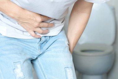 A man Stomach ache because of gastritis or  that are sign of stomach trouble. background white. Health concept