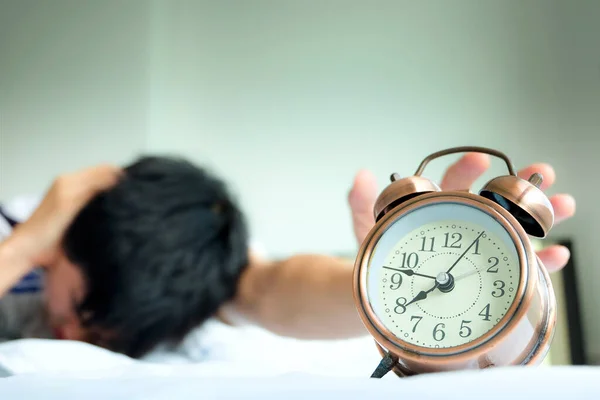 Young Man Uses His Hands Turn Alarm Clock Morning Lazy — Φωτογραφία Αρχείου