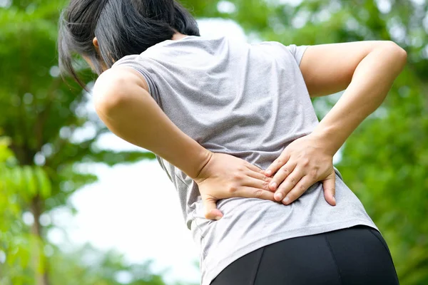 Woman Hand She Caught Waist Her Back Painful Back Park — Stock Photo, Image