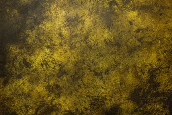 Yellow weathered wall textured background with golden tones. Aged wall.