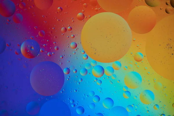 Abstract Background with orange and blue Bubbles in Water. Macro photography. Top view.