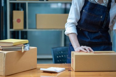 Online sales woman business owner Receive orders and deliver products with boxes to customers. Online SME business concept.