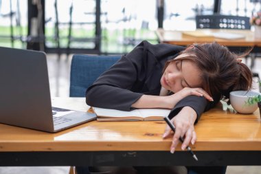 Burnout syndrome at work concept. exhausted overworked woman working in office.Concept Burnout Syndrome.
