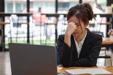 Burnout syndrome at work concept. exhausted overworked woman working in office.Concept Burnout Syndrome.