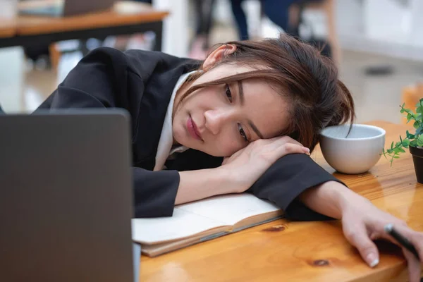 Burnout syndrome at work concept. exhausted overworked woman working in office.Concept Burnout Syndrome.