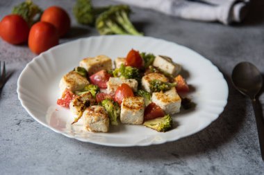 Close up of paneer or cottage cheese tikka in a white plate. Selective focus.