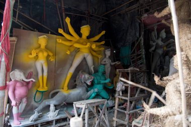 With the biggest festival of India Durga puja approaching, preparations are in full swing. Half painted idol of the Goddess. 