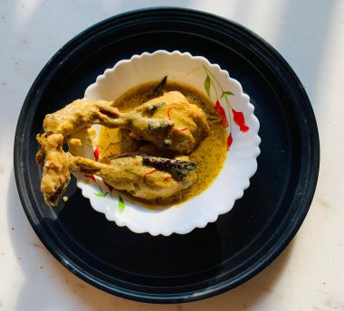 Chicken Rezala is a Mughlai preparation that's made with juicy chicken on bones traditionally slow cooked in an extremely flavorful