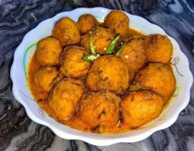 Dum Aloo is a delicious recipe of baby potatoes cooked in a gravy or sauce