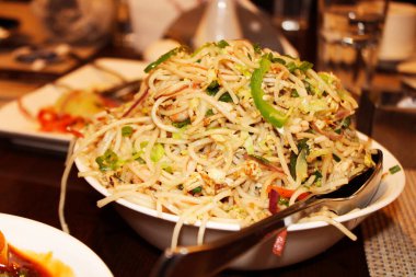 Chow mein are Chinese stir-fried noodles with vegetables and sometimes meat or tofu