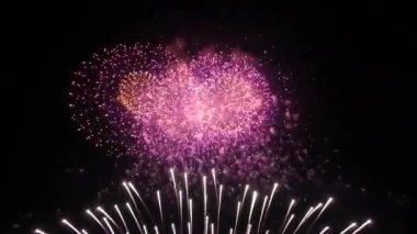 Colorful Real Fireworks light up the dark sky with dazzling display celebration