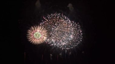 Colorful Real Fireworks light up the dark sky with dazzling display celebration