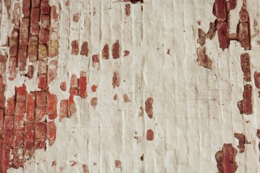 Boş Eski Tuğla Duvar dokusu. Boyanmış Duvar Yüzeyi. Hasarlı Alçıyla Cephe