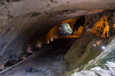 Zugarramurdi, Spain; April 14, 2022: A group of tourists visit the interior of the Cave of the Witches of Zugarramurdi