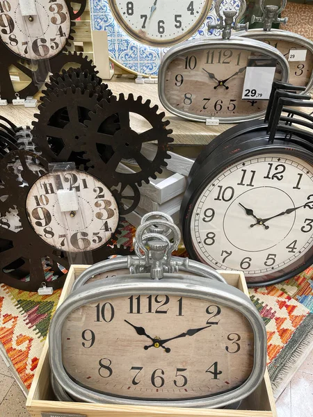 a display with a group of vintage watches, concept of time passing by, antique watches imitation, wall clock, vertical