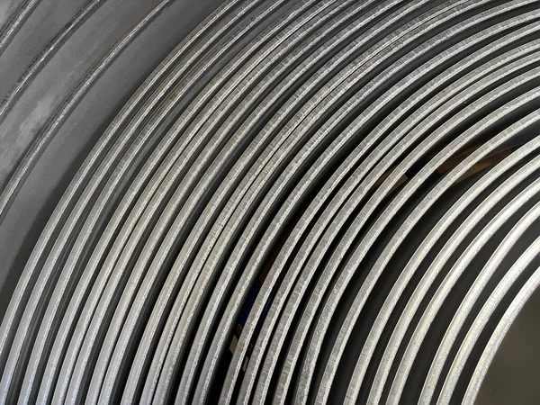 details of the edges of a steel coil, steel coil texture for metalworking production, cold stamping, raw material for mass production of parts, horizontal