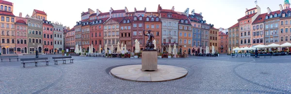 Panorama of the old market square with colorful facades of old houses at dawn. Warsaw. Poland.