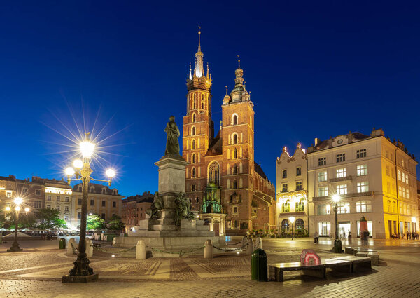 St. Marys Church on the market square in night lighting. Krakow. Poland.