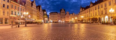 Panoramic view of the market square in the early morning in night illumination. Wroclaw. Poland.