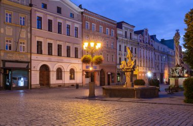 View of the old medieval market square and the facades of traditional colorful houses at dawn. Swidnica. Poland.