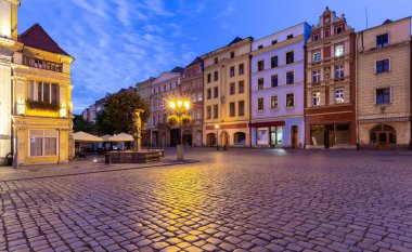 View of the old medieval market square and the facades of traditional colorful houses at dawn. Swidnica. Poland.