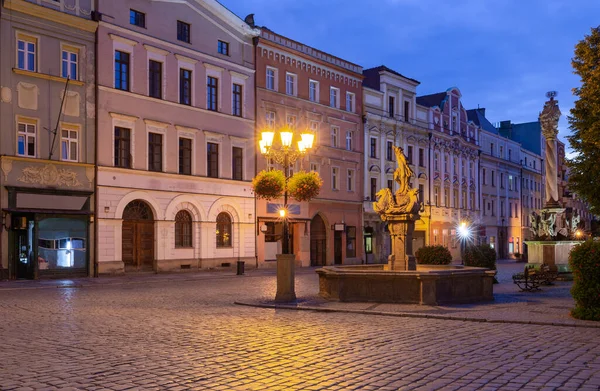 View of the old medieval market square and the facades of traditional colorful houses at dawn. Swidnica. Poland.