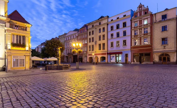 View of the old medieval market square and the facades of traditional colorful houses at dawn. Swidnica. Poland.