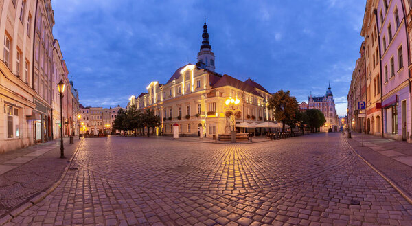 Panorama of the old medieval market square and the facades of traditional colorful houses at dawn. Swidnica. Poland.
