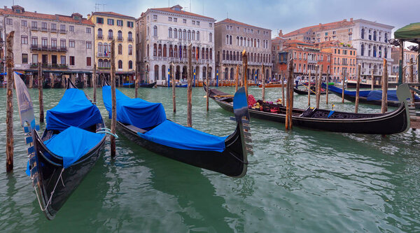 Facades of beautiful old medieval houses along the canal. Venice. Italy.
