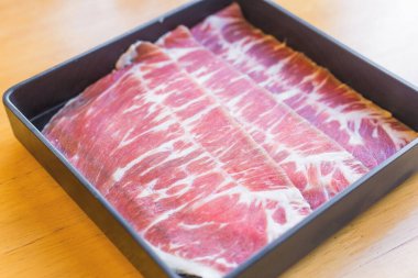 Hump is fresh beef raw sliced was served for Sukiyaki ,Korean grilled beef and Shabu or Yakiniku restaurant which it put on black plate.