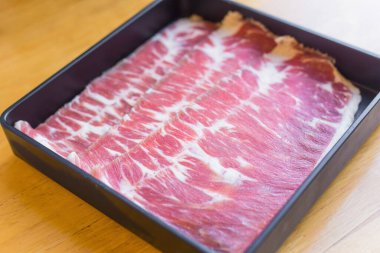 Hump is fresh beef raw sliced was served for Sukiyaki ,Korean grilled beef and Shabu or Yakiniku restaurant which it put on black plate.