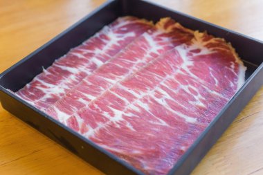 Hump is fresh beef raw sliced was served for Sukiyaki ,Korean grilled beef and Shabu or Yakiniku restaurant which it put on black plate.