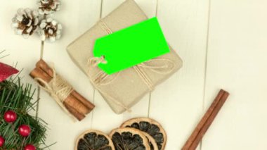 Box with twine and tag, background with copy space. Chroma key. Christmas card. View from above. Copy space - image. Camera zoom