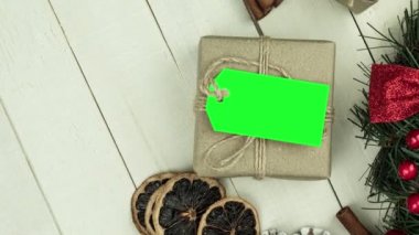 Box with twine and tag, background with copy space. Chroma key. Christmas card. View from above. Copy space - image. Camera zoom